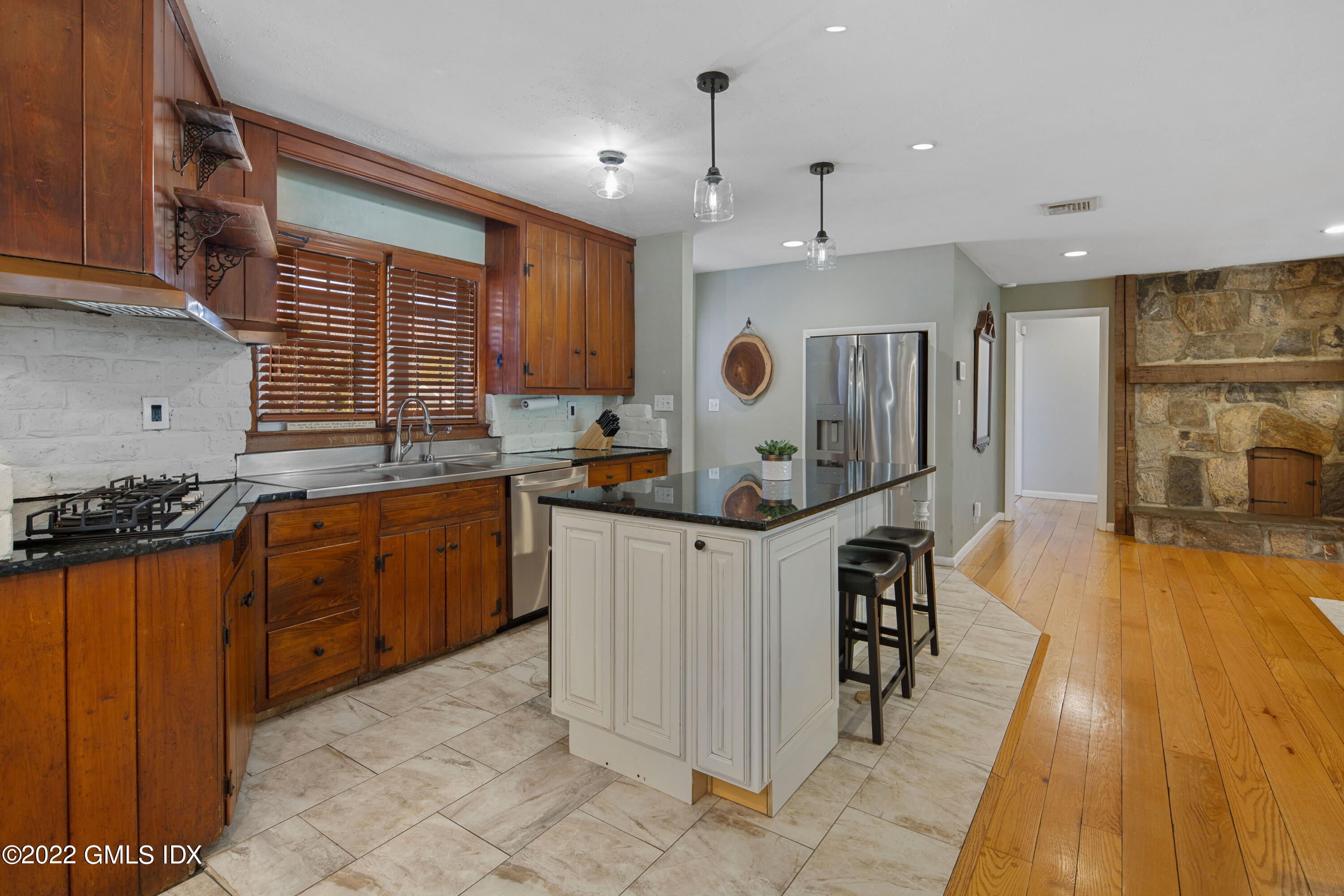 66 Simsbury Road Stamford, CT 06905 - Photo 14 of 40 a kitchen with stainless steel appliances granite countertop a stove a sink dishwasher and a refrigerator