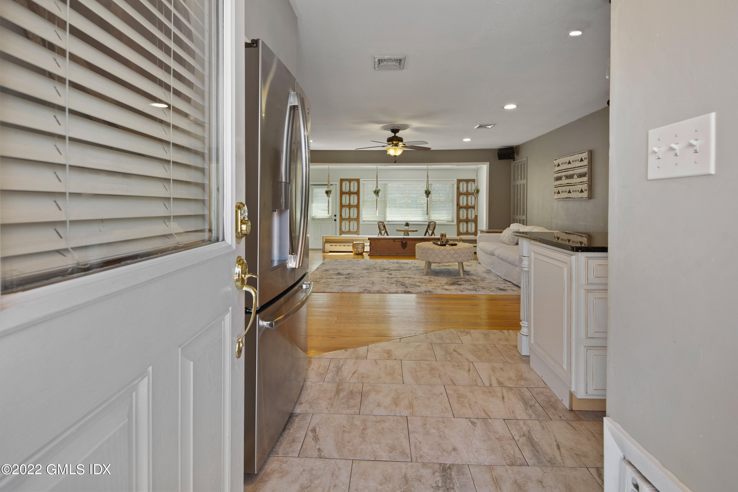 66 Simsbury Road Stamford, CT 06905 - Photo 2 of 40 a view of living room kitchen with stainless steel appliances furniture
