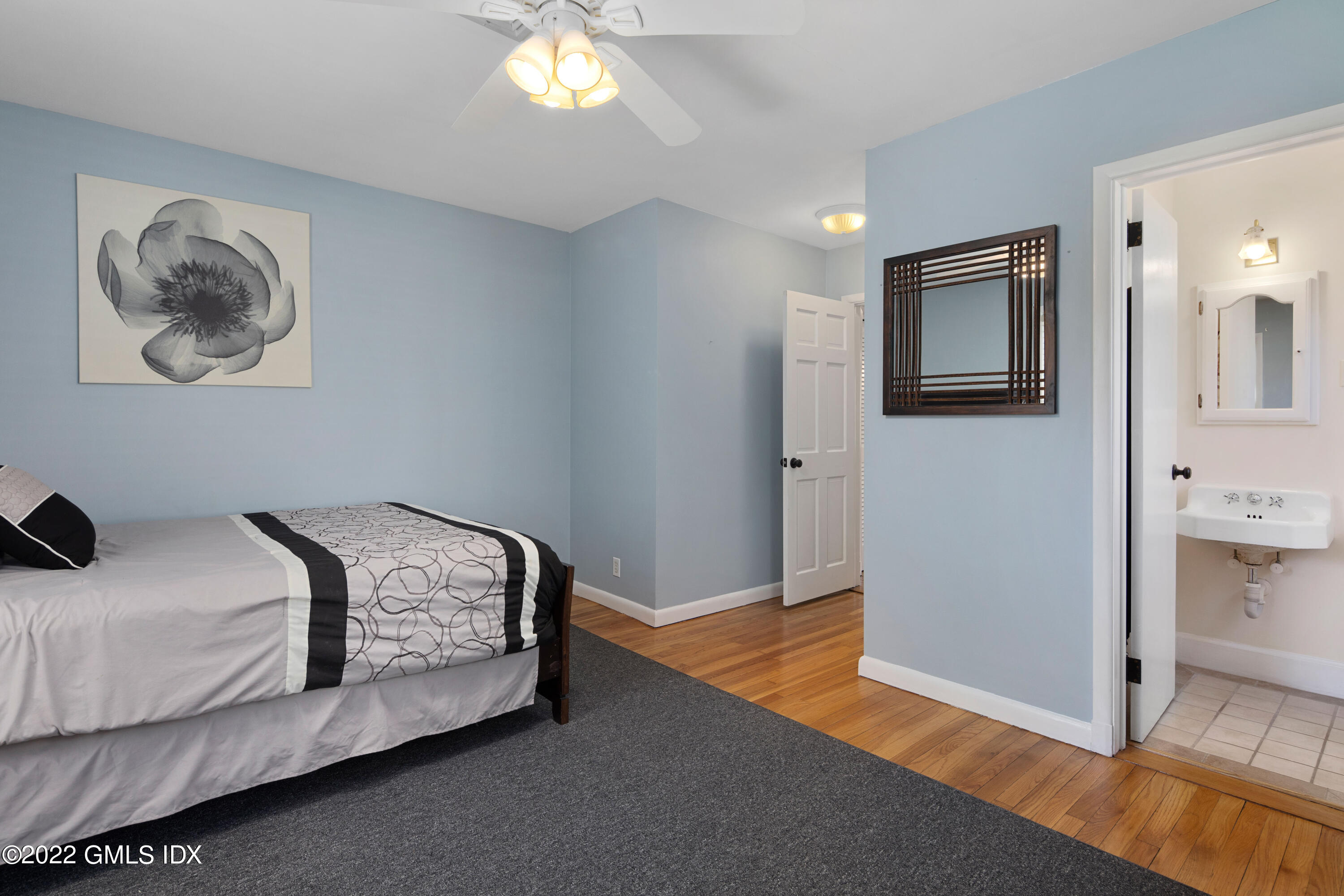 66 Simsbury Road Stamford, CT 06905 - Photo 21 of 40 a bedroom with a bed and a view of livingroom