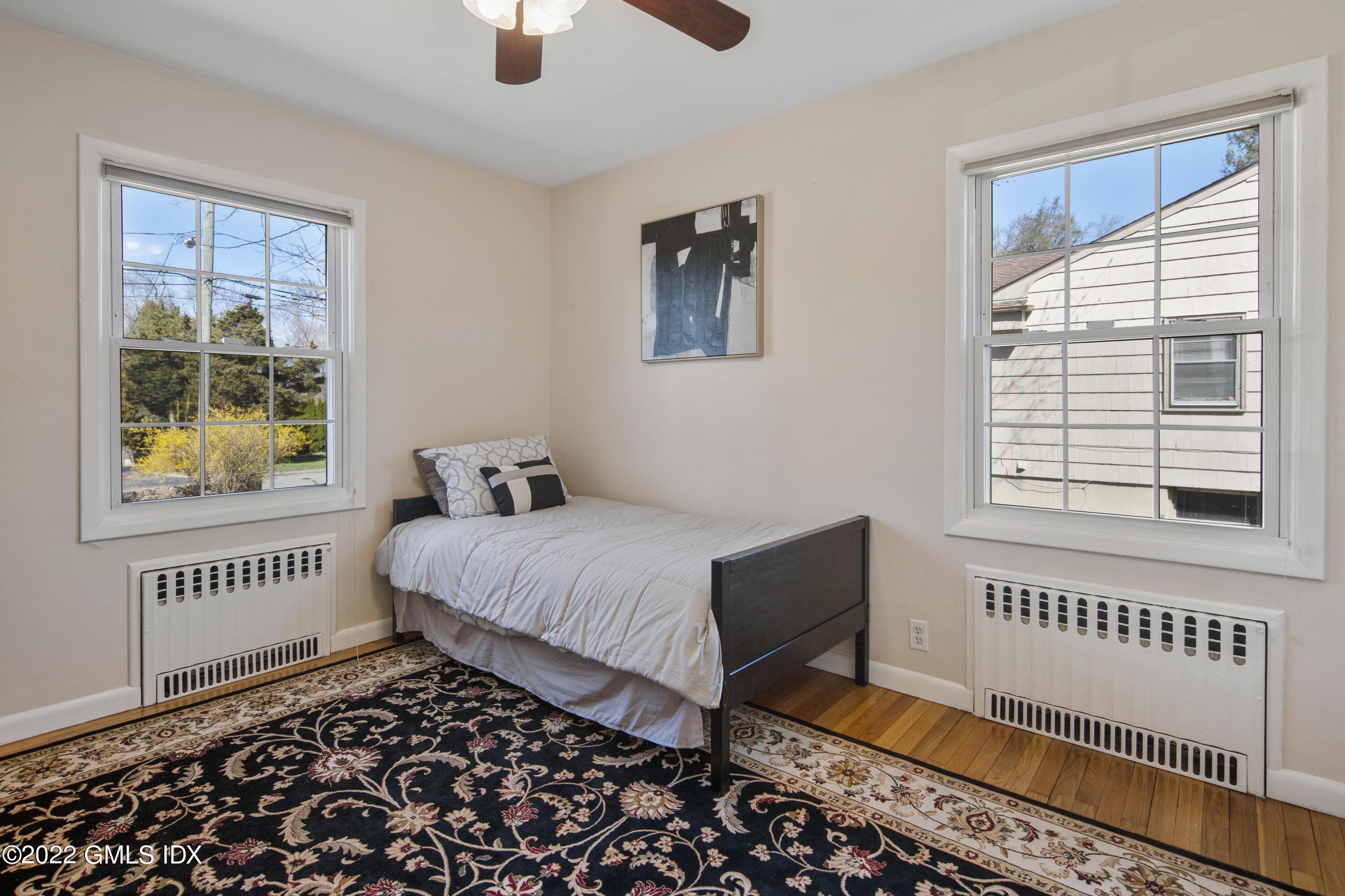 66 Simsbury Road Stamford, CT 06905 - Photo 22 of 40 a bedroom with bed and a window
