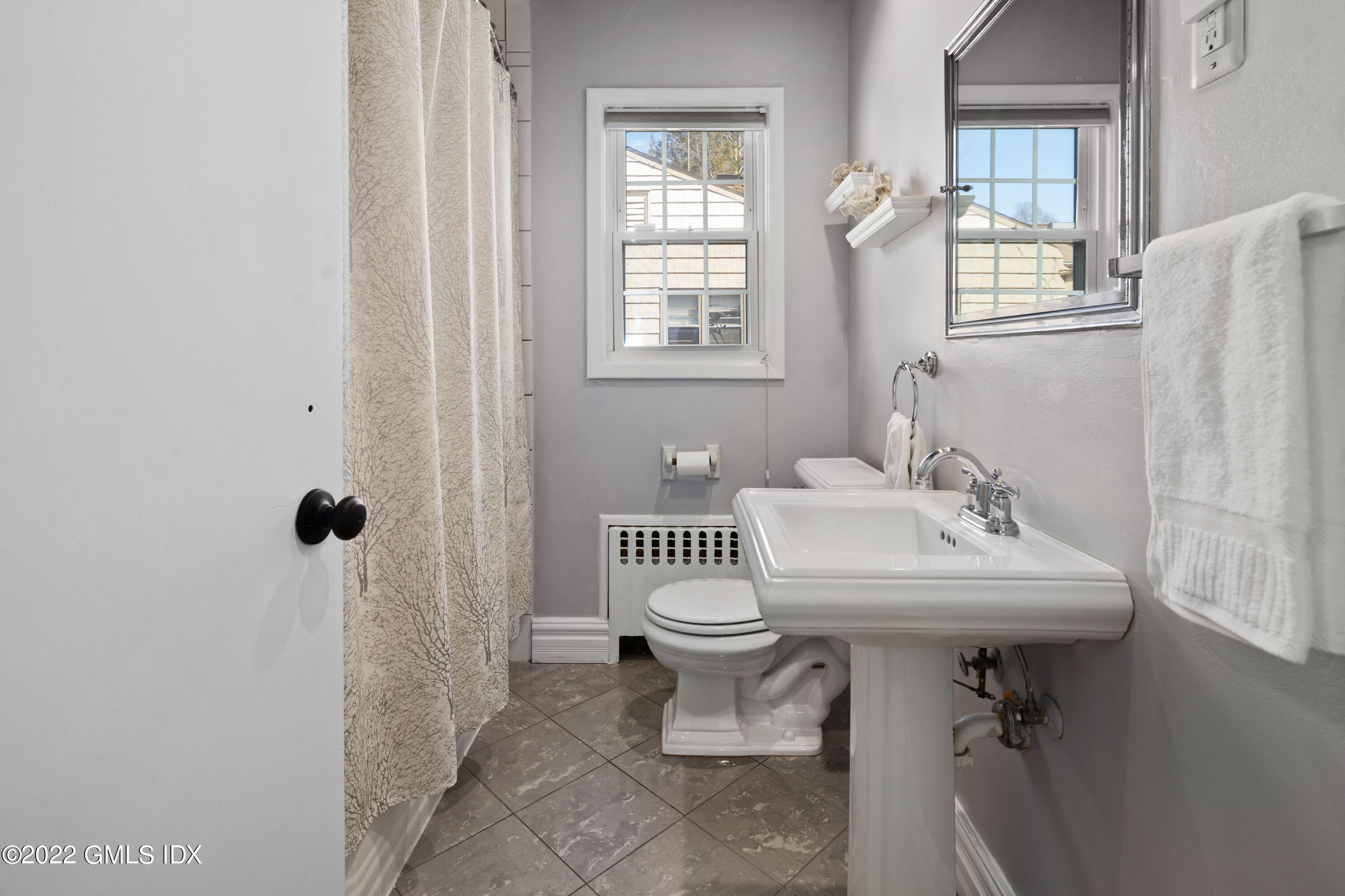 66 Simsbury Road Stamford, CT 06905 - Photo 24 of 40 a bathroom with a sink toilet and shower