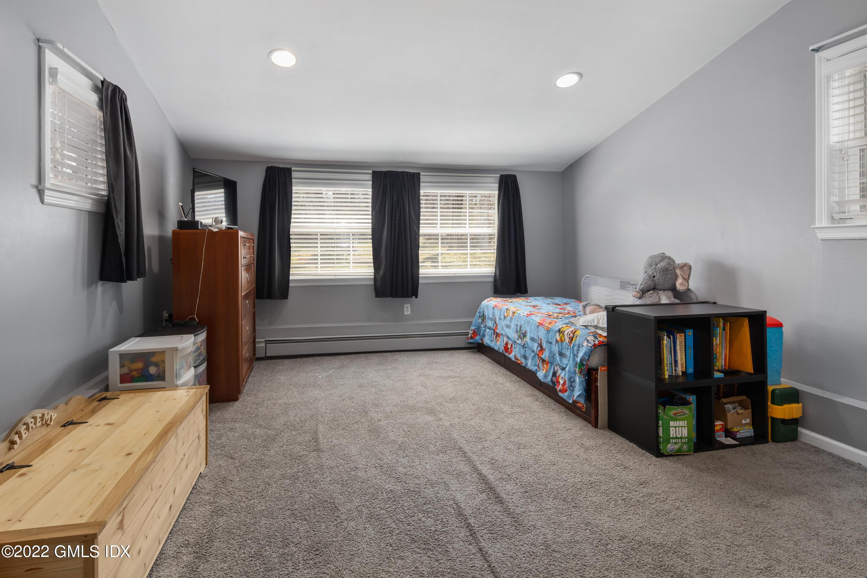 66 Simsbury Road Stamford, CT 06905 - Photo 25 of 40 a bedroom with furniture and a window
