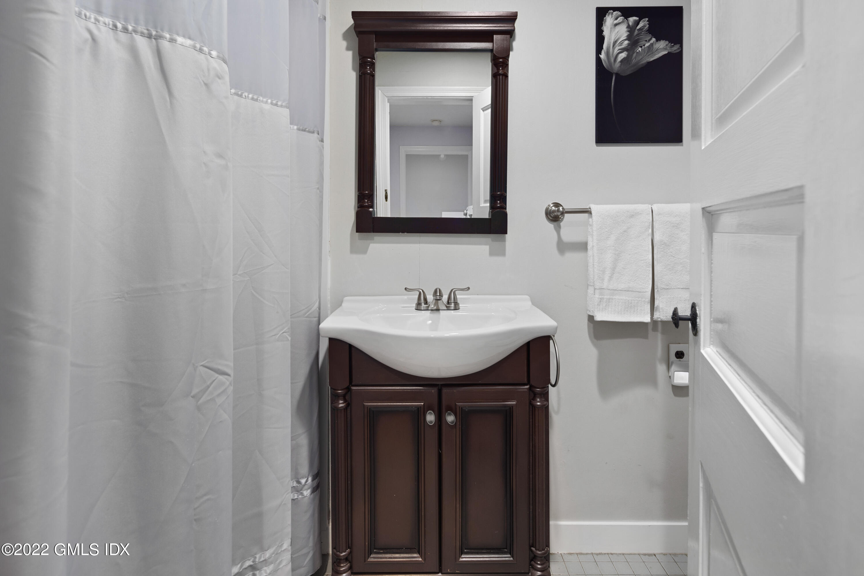 66 Simsbury Road Stamford, CT 06905 - Photo 28 of 40 a bathroom with a sink and a mirror