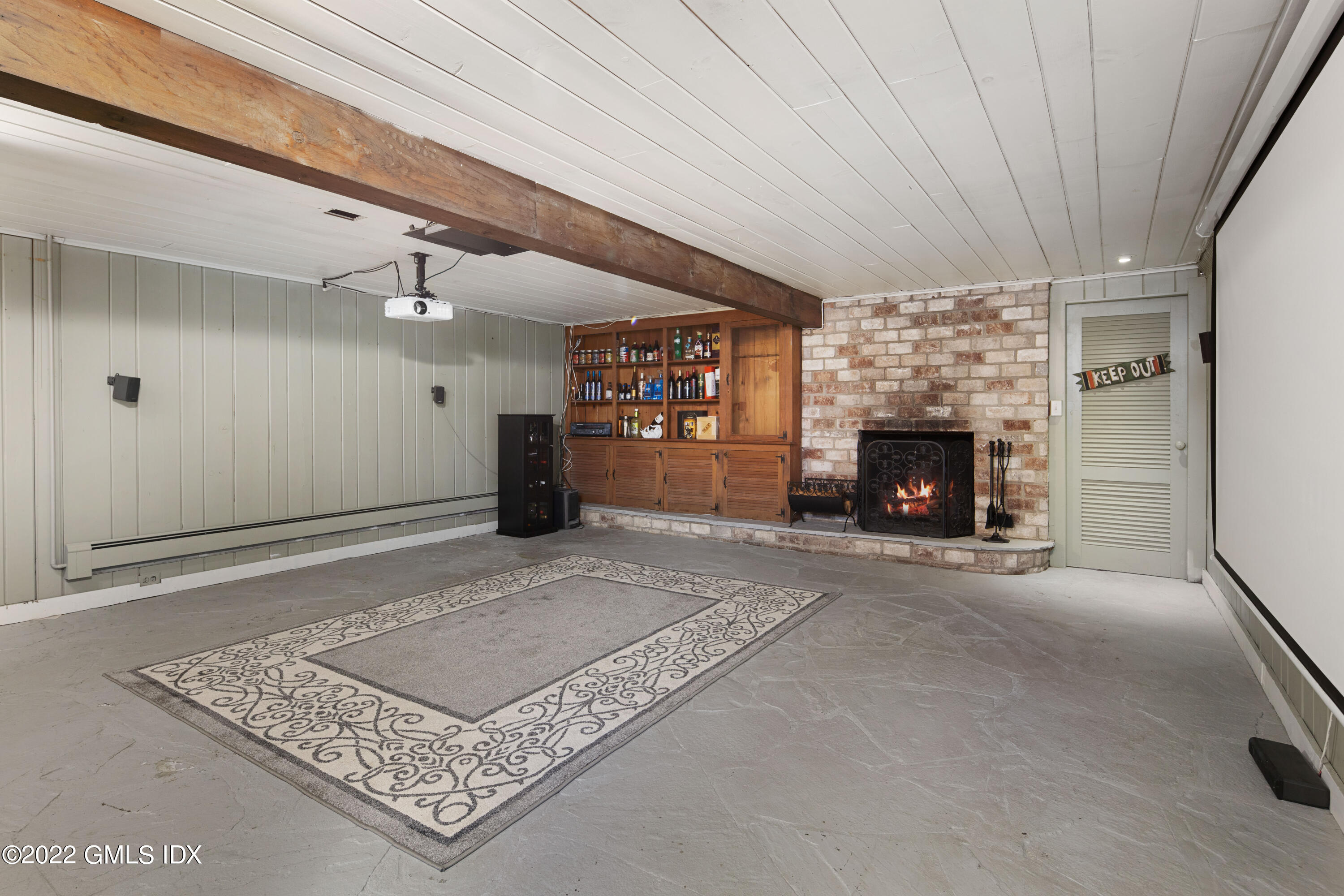 66 Simsbury Road Stamford, CT 06905 - Photo 30 of 40 a living room with furniture and a fireplace