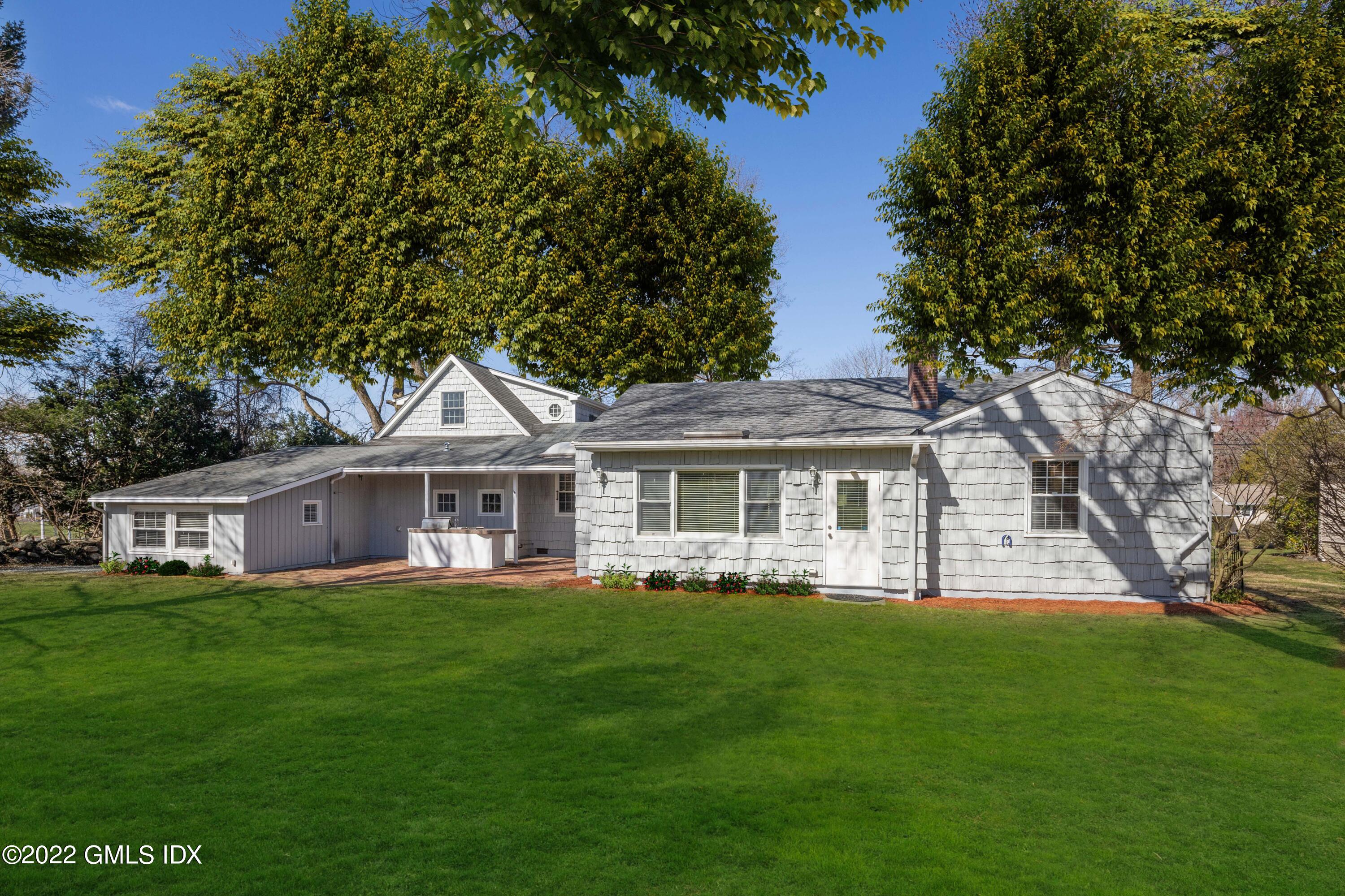 66 Simsbury Road Stamford, CT 06905 - Photo 31 of 40 a front view of house with yard and green space