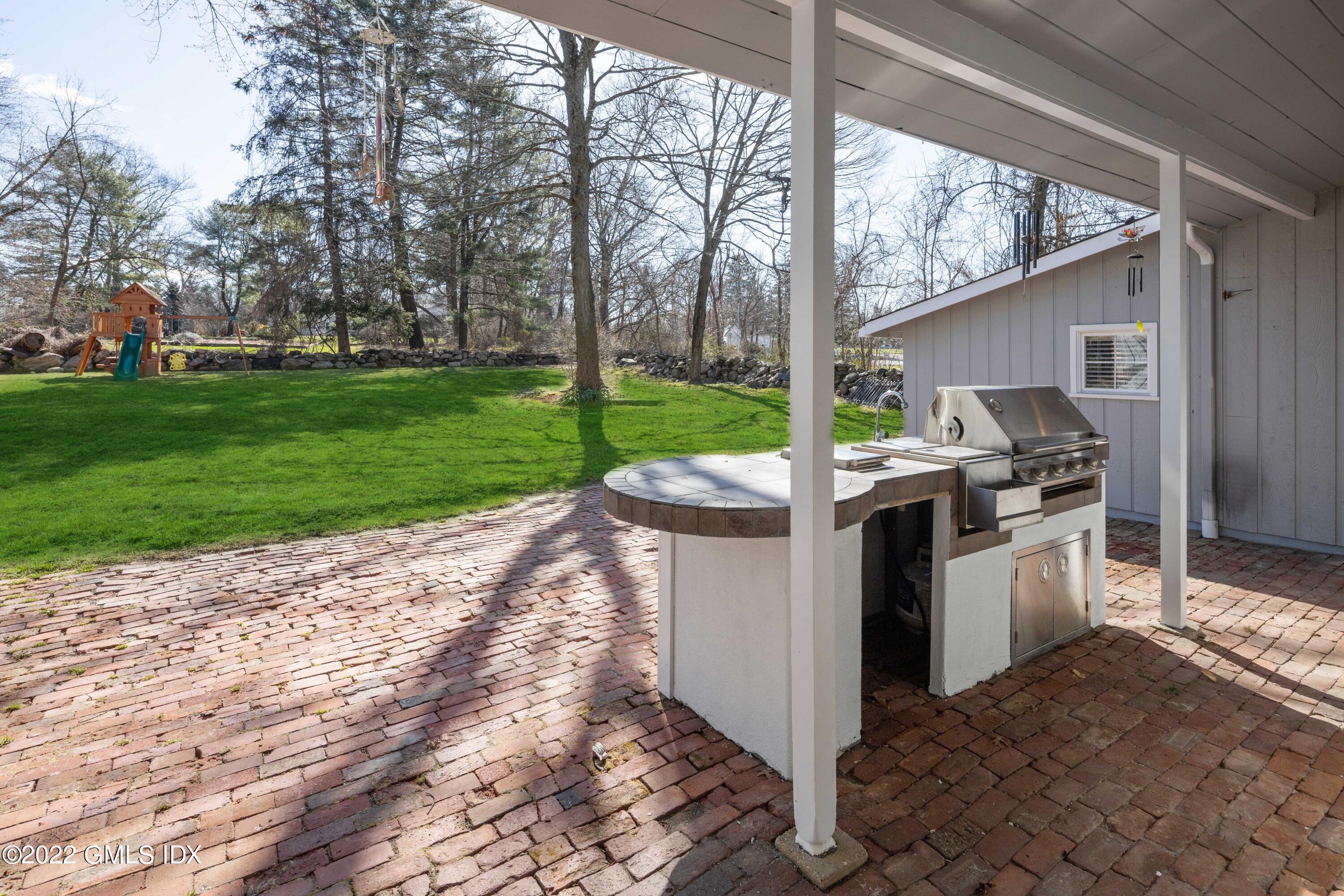 66 Simsbury Road Stamford, CT 06905 - Photo 32 of 40 a view of a patio with a yard