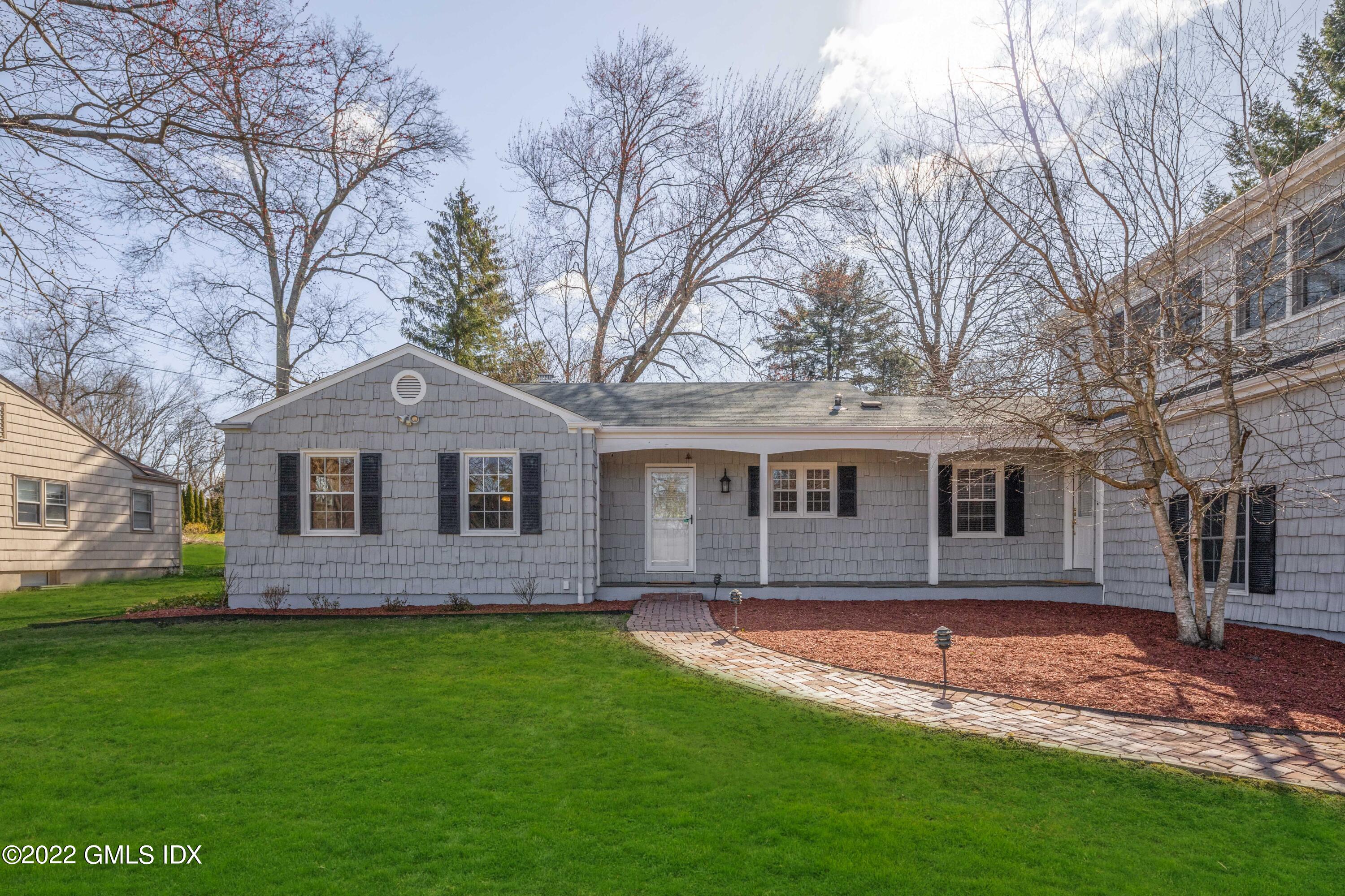 66 Simsbury Road Stamford, CT 06905 - Photo 36 of 40 a front view of a house with a garden