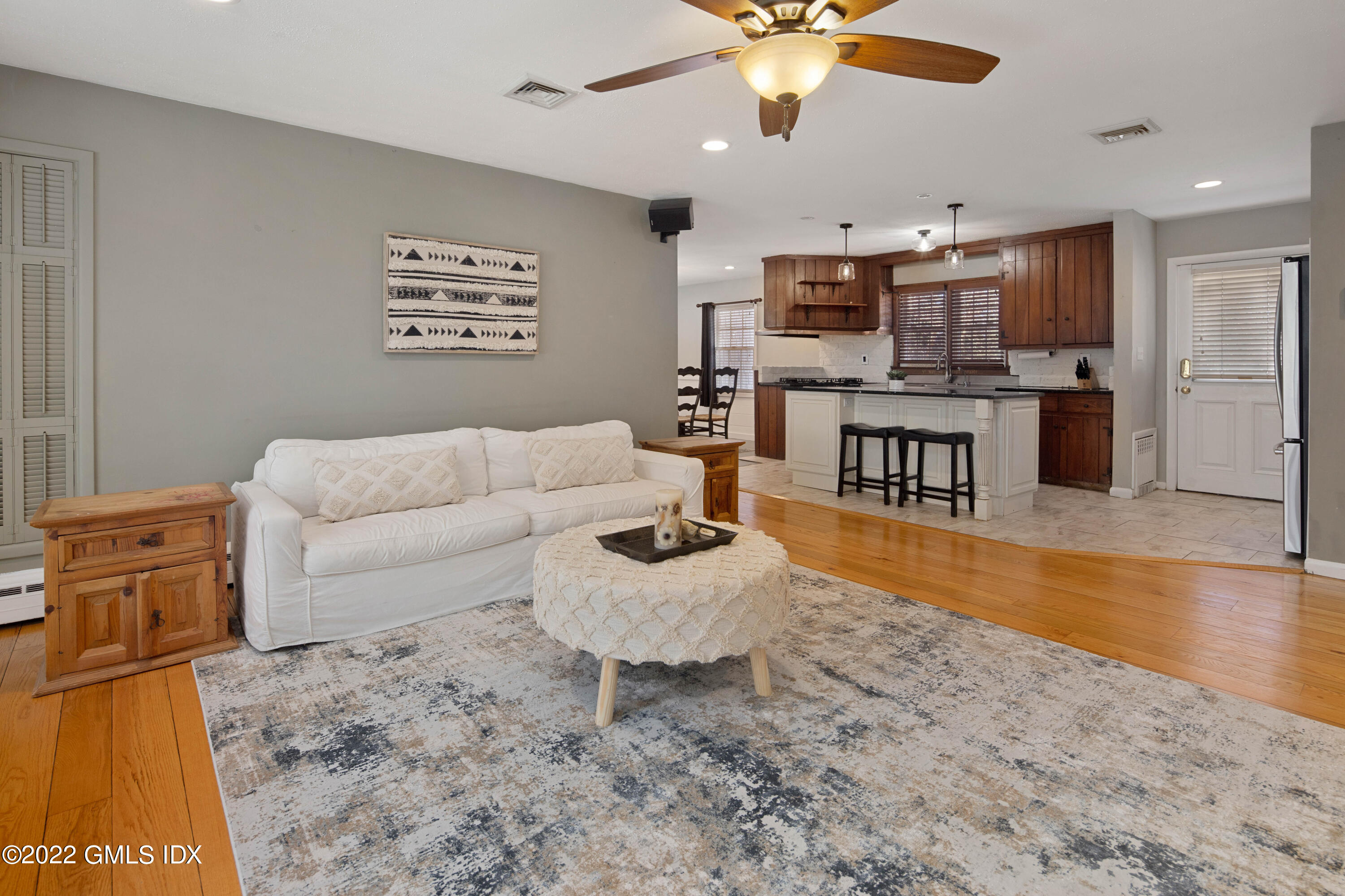 66 Simsbury Road Stamford, CT 06905 - Photo 7 of 40 a living room with furniture and kitchen view