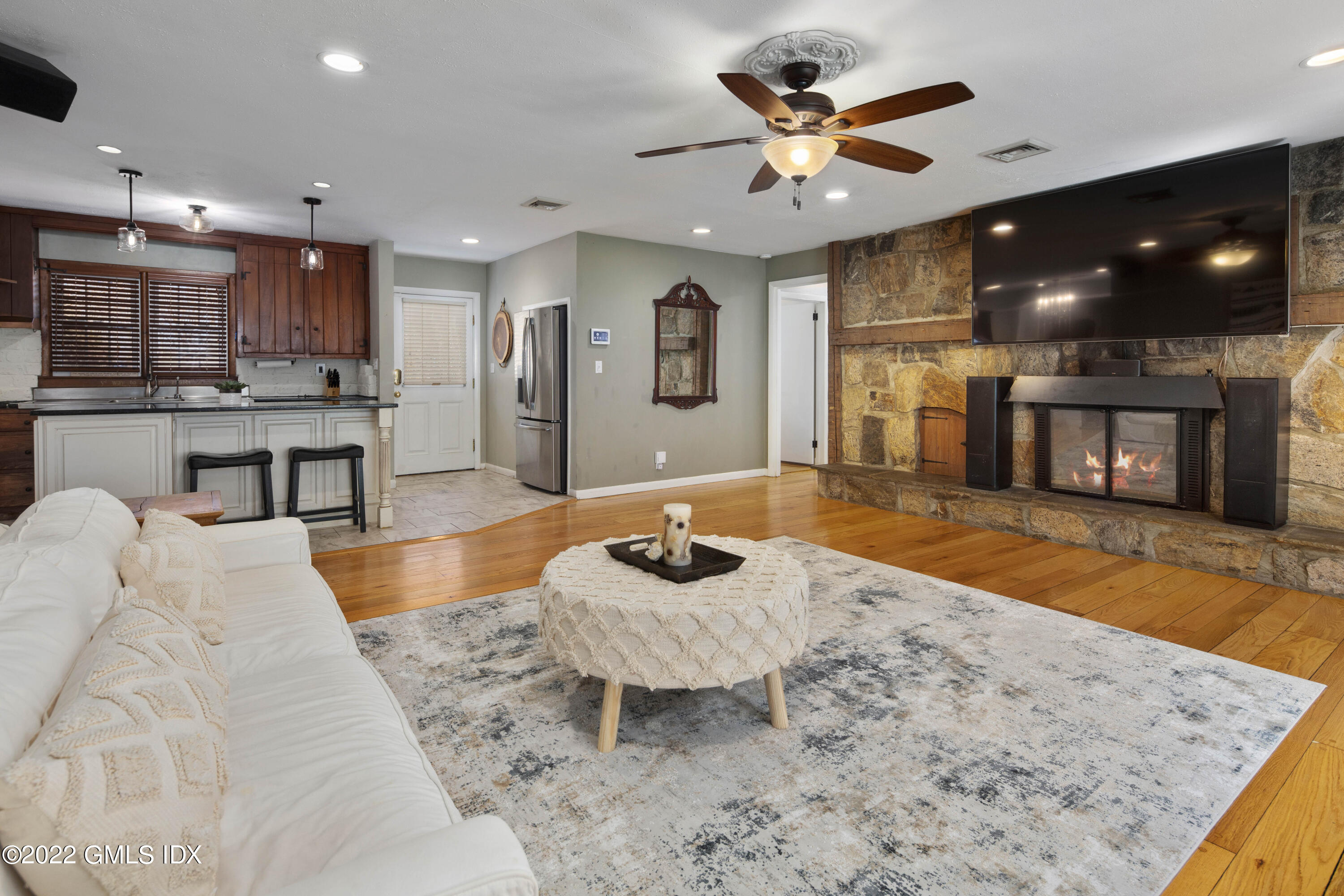 66 Simsbury Road Stamford, CT 06905 - Photo 8 of 40 a living room with stainless steel appliances furniture a rug and a kitchen view