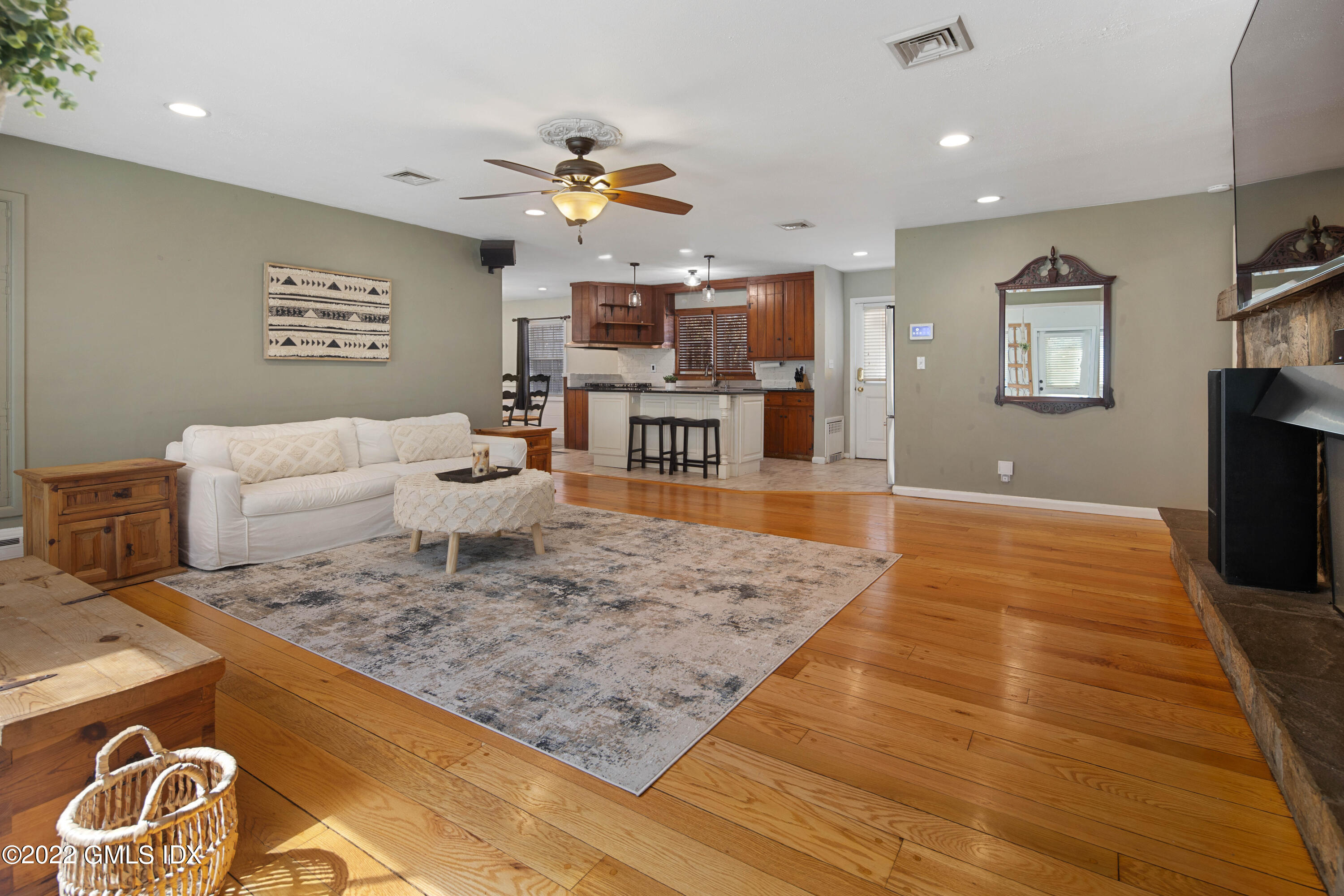 66 Simsbury Road Stamford, CT 06905 - Photo 9 of 40 a living room with dining room and wooden floor