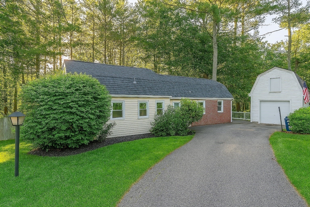 70 Bardin Street Hanover, MA 02339 - Photo 1 of 29 a front view of a house with a yard and trees
