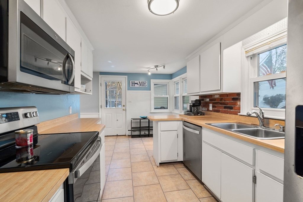 70 Bardin Street Hanover, MA 02339 - Photo 13 of 29 a kitchen with a sink cabinets and window