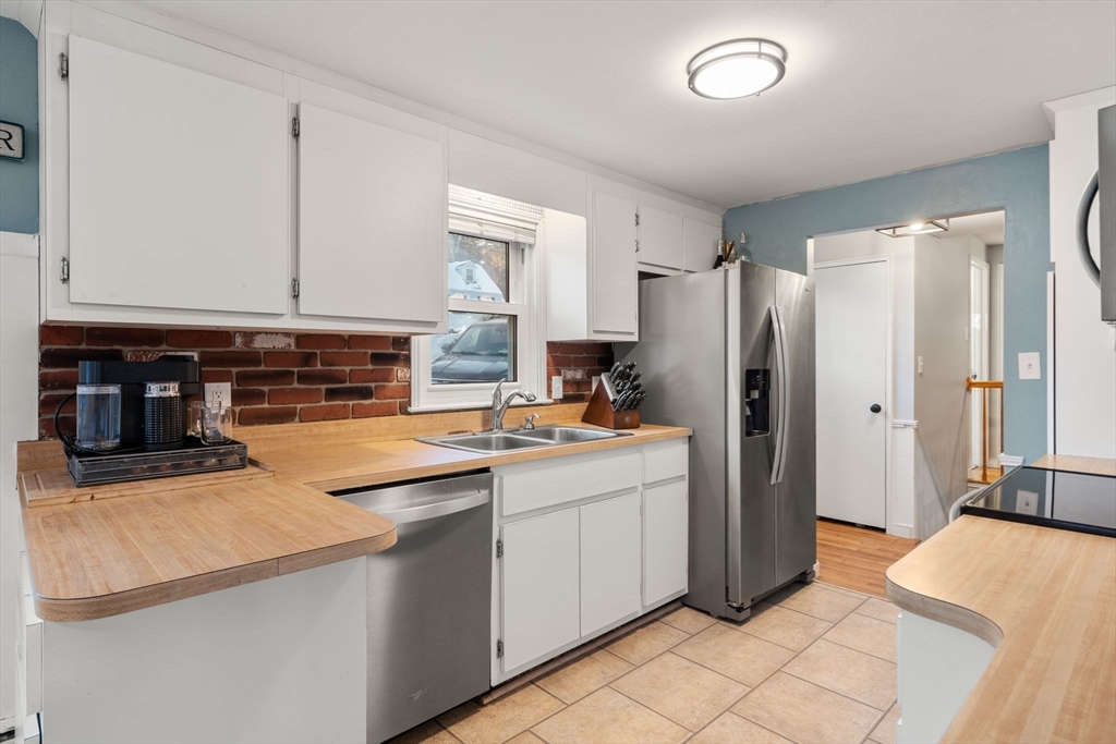 70 Bardin Street Hanover, MA 02339 - Photo 14 of 29 a kitchen with stainless steel appliances a refrigerator sink and cabinets