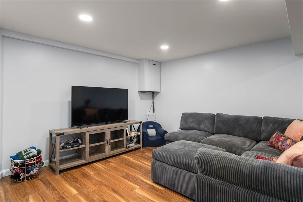 70 Bardin Street Hanover, MA 02339 - Photo 22 of 29 a living room with furniture and a flat screen tv