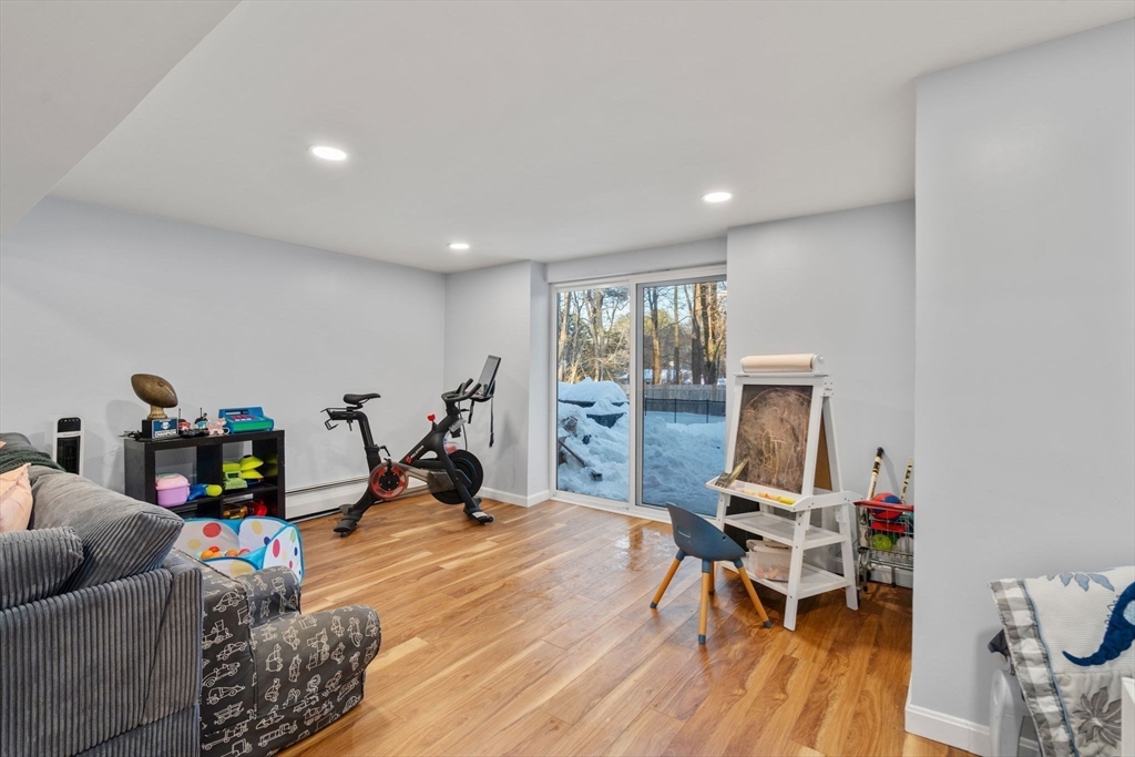 70 Bardin Street Hanover, MA 02339 - Photo 23 of 29 a living room with furniture and a wooden floor