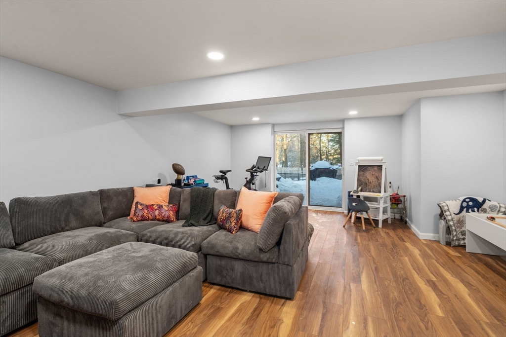 70 Bardin Street Hanover, MA 02339 - Photo 25 of 29 a living room with furniture and a wooden floor
