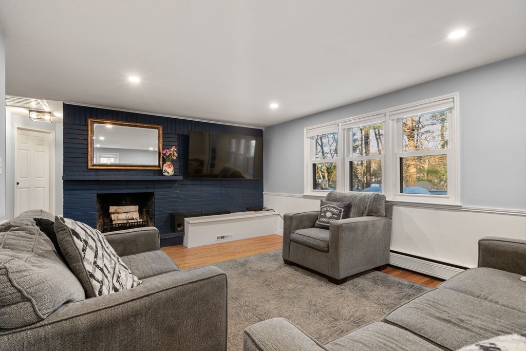 70 Bardin Street Hanover, MA 02339 - Photo 6 of 29 a living room with furniture and a flat screen tv