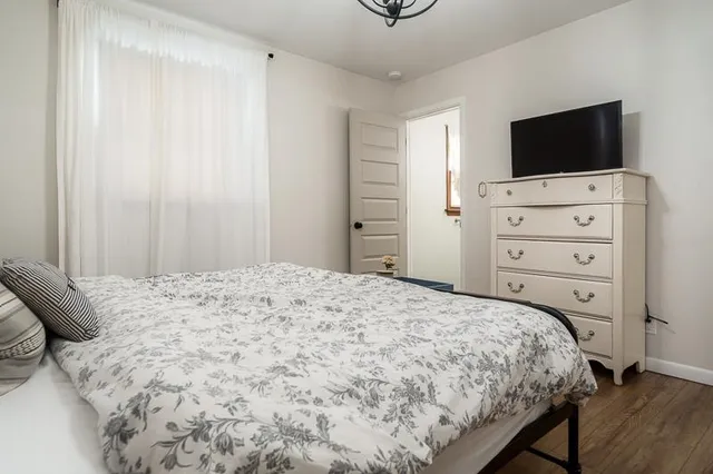 a bathroom with a sink mirror and toilet