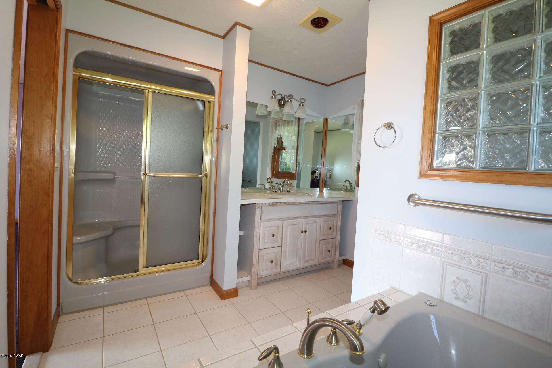 53 Savitz Road Lake Ariel, PA 18436 - Photo 32 of 53 a bathroom with a tub sink and mirror