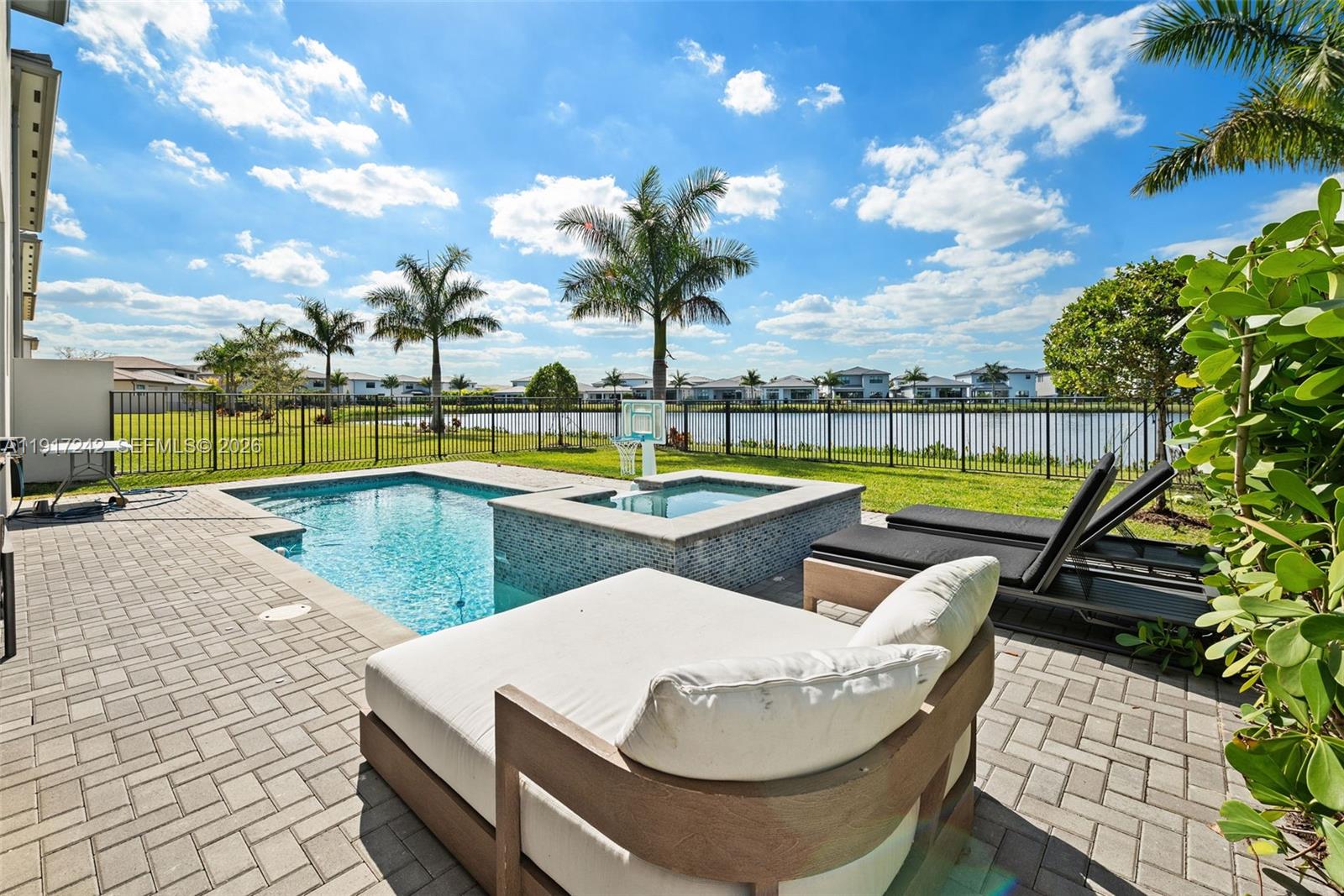 a view of swimming pool with outdoor seating