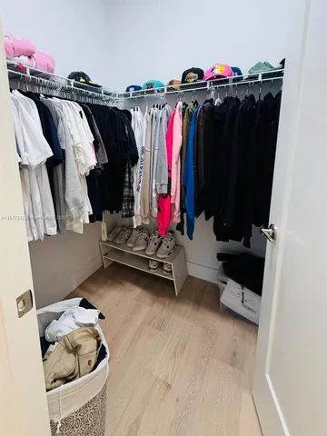 a bathroom with a bathtub sink and window