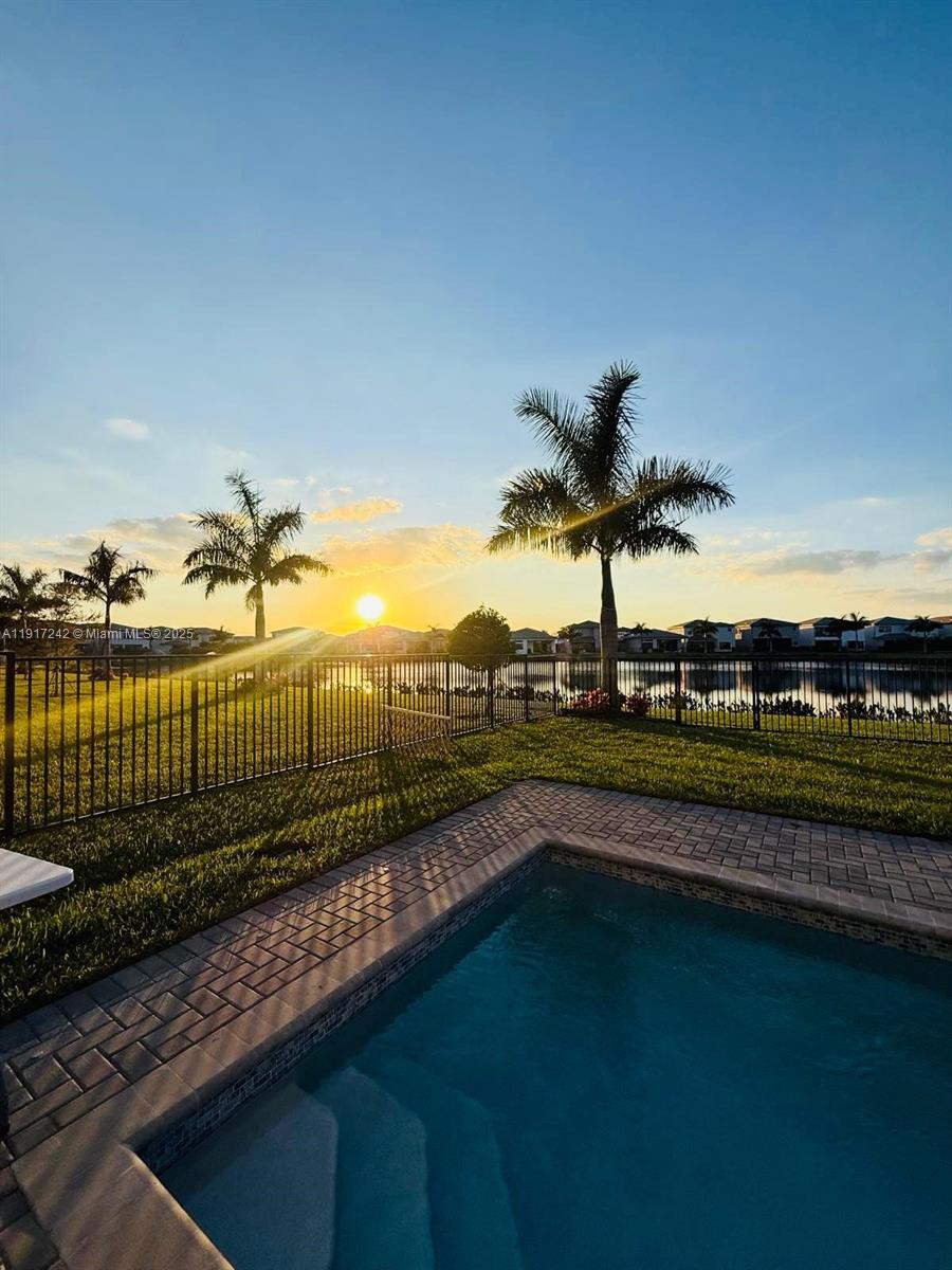 8185 Crystal Downs Avenue Boca Raton, FL 33434 - Photo 2 of 27 a view of a swimming pool and a terrace