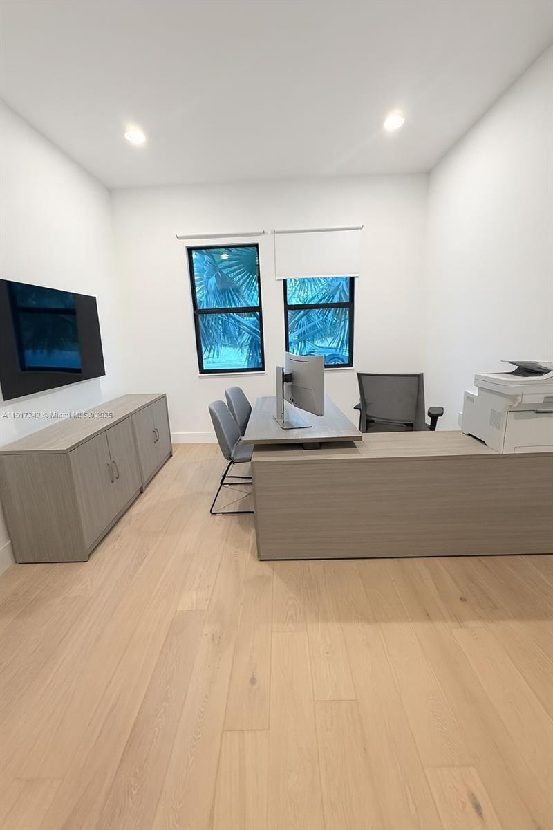 8185 Crystal Downs Avenue Boca Raton, FL 33434 - Photo 23 of 27 a living room with furniture and a flat screen tv