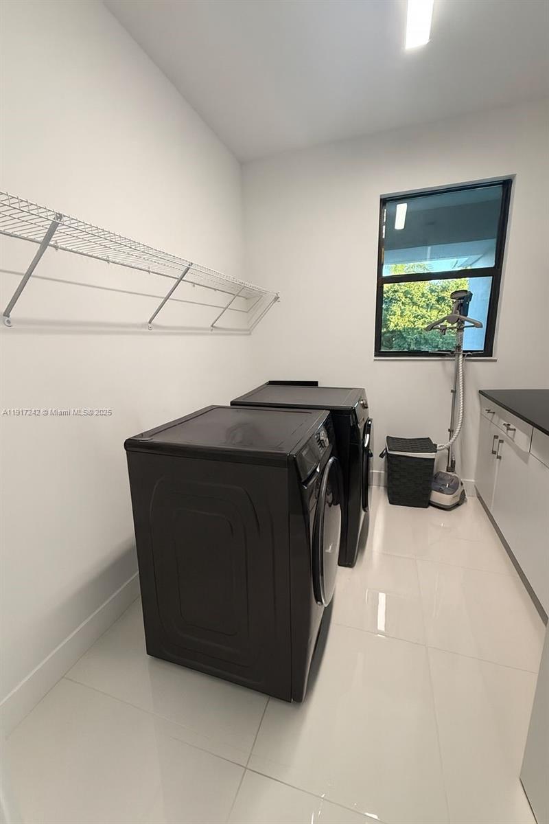 8185 Crystal Downs Avenue Boca Raton, FL 33434 - Photo 27 of 27 a utility room with two washing machine