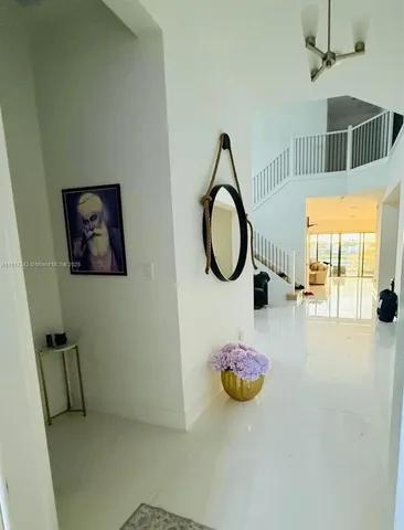 a living room with furniture and a chair