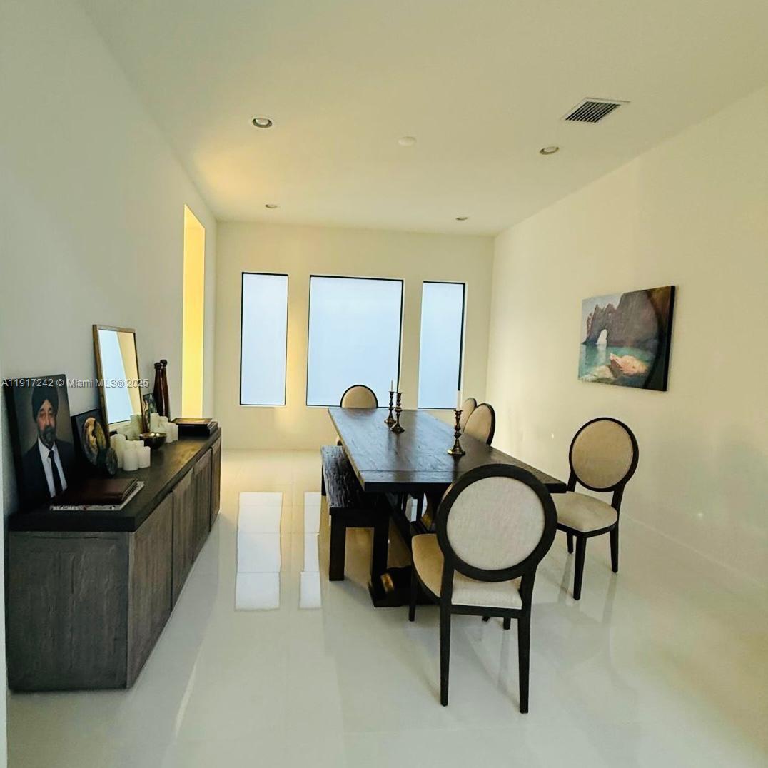 8185 Crystal Downs Avenue Boca Raton, FL 33434 - Photo 7 of 27 a living room with furniture and a chair