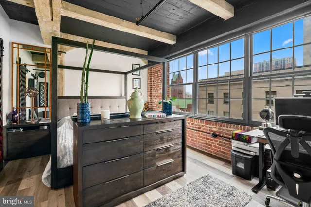 a room with lots of furniture and windows