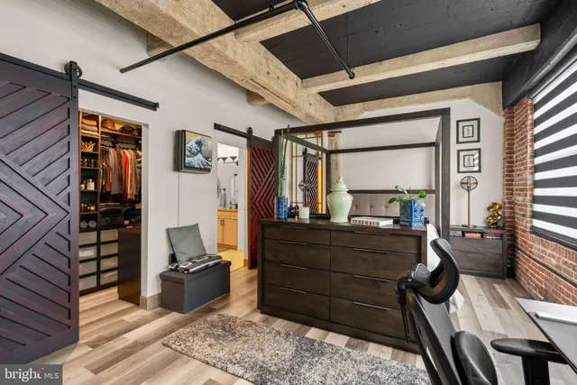 a bed room with furniture and a window