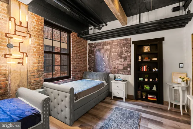 a bed room with a bed and a window