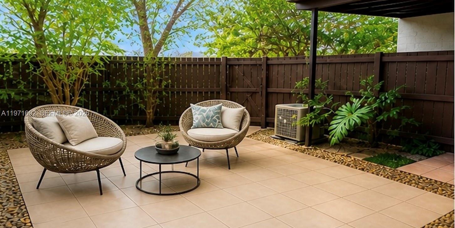 9001 Southwest 94th Street, Unit 113 Miami, FL 33176 - Photo 3 of 16 a view of a chairs and tables in backyard