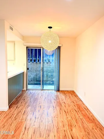 a view of a hallway with a chandelier