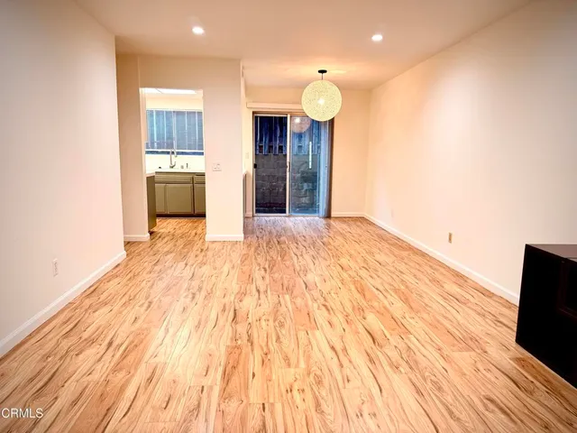 a view of kitchen with cabinets and wooden floor