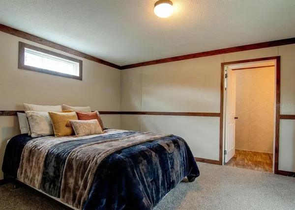 a bathroom with a toilet a sink and a window
