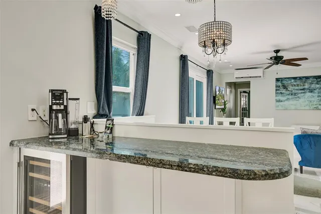 a bathroom with sink granite and a mirror