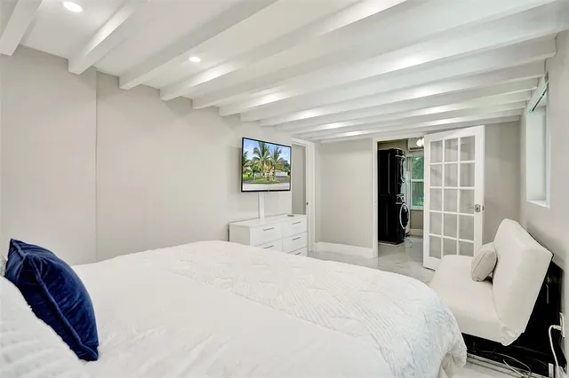 a bedroom with a large bed and a couch