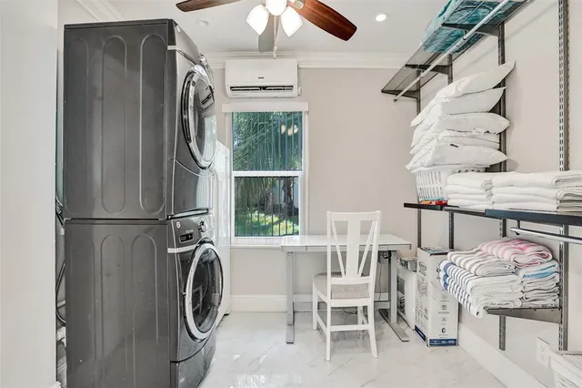 a kitchen with stainless steel appliances a refrigerator a table and chairs