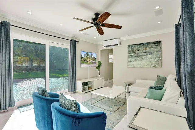 a living room with furniture and a large window