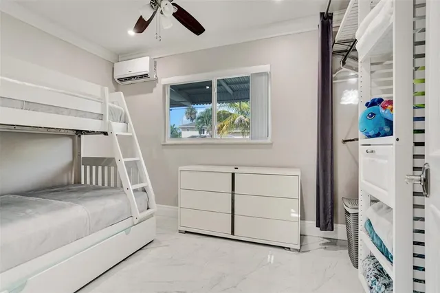 a view of a livingroom with furniture and a ceiling fan