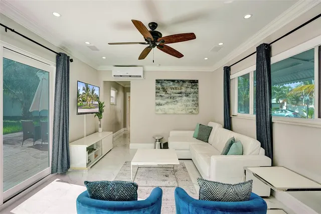 a living room with furniture and a large window