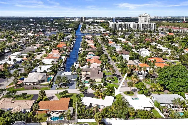 an aerial view of residential building with parking
