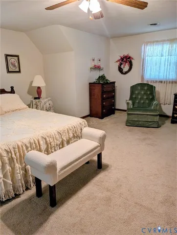a bedroom with furniture and a bed