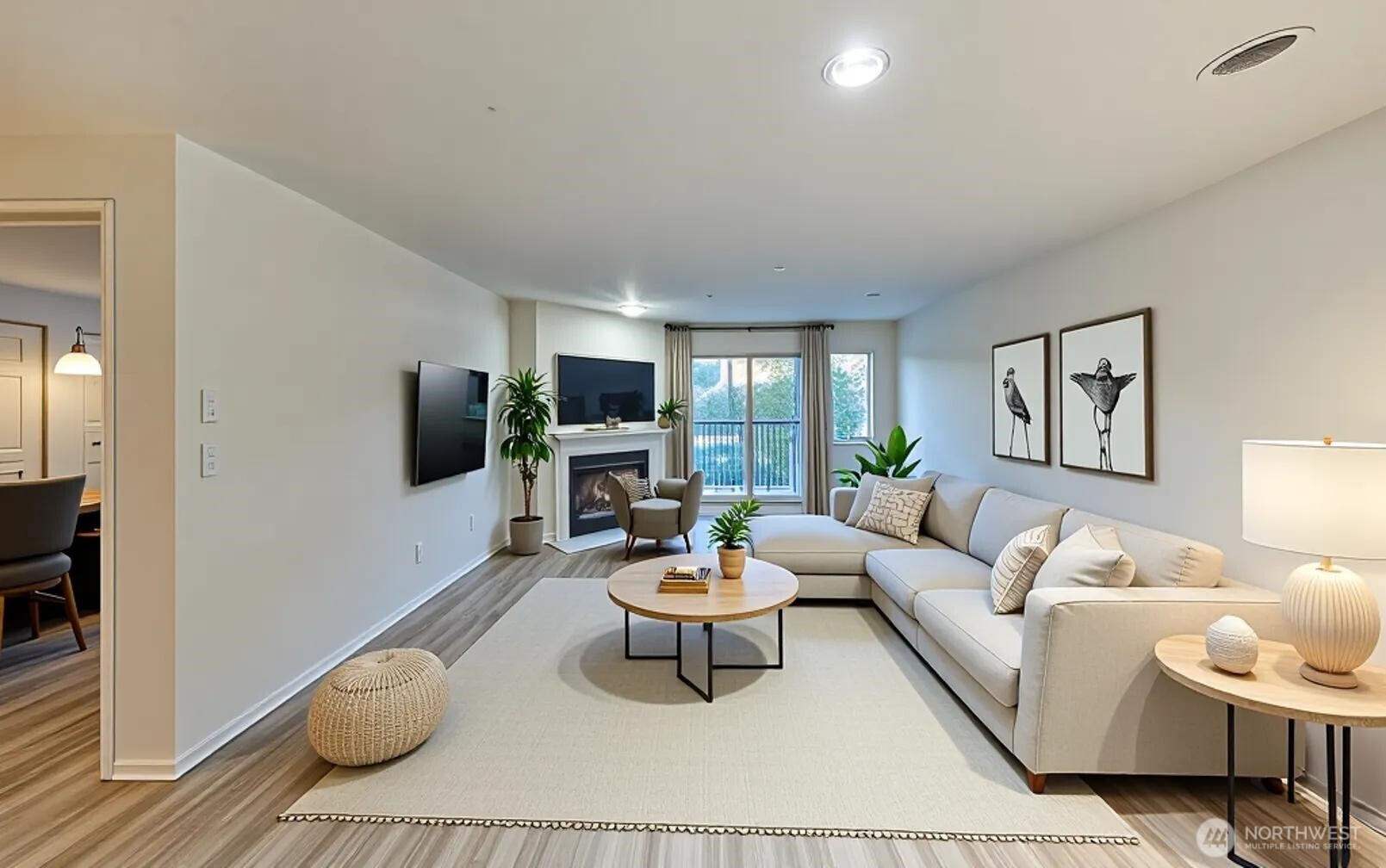 a living room with furniture a flat screen tv and a dining table