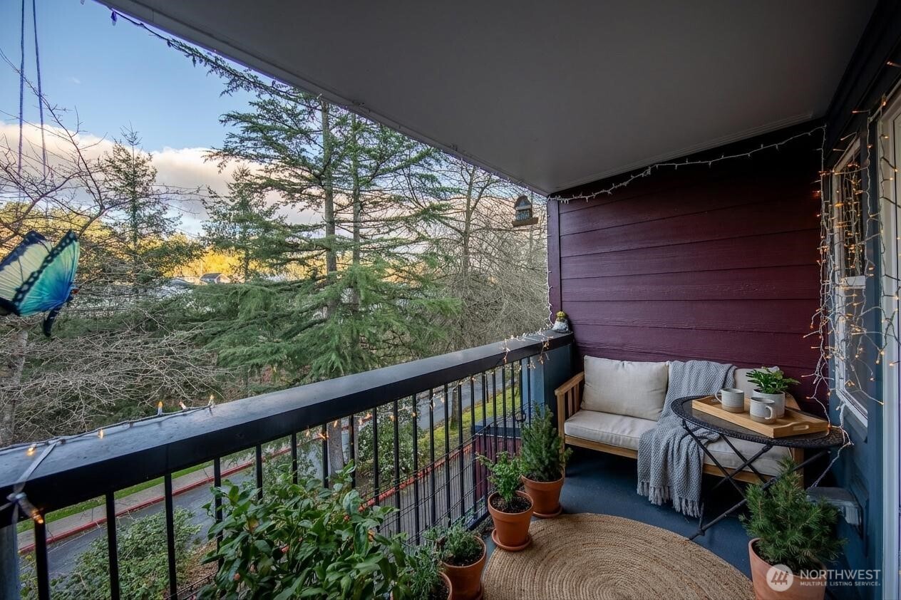 15917 Waynita Way Northeast, Unit E206 Bothell, WA 98011 - Photo 11 of 22 a view of a balcony with furniture