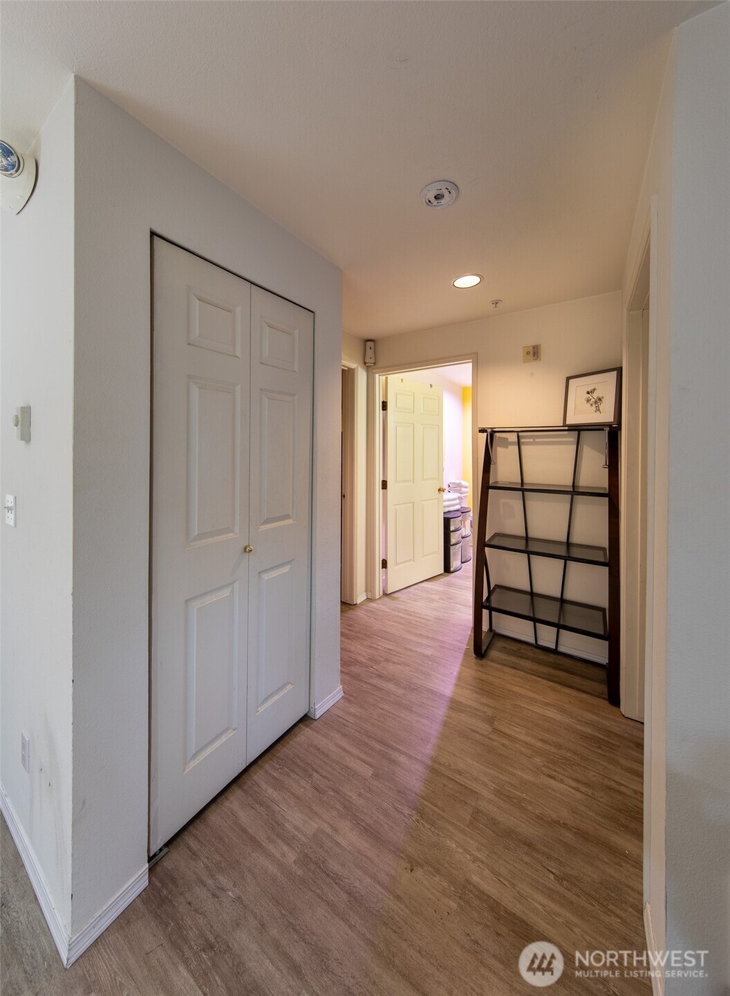 15917 Waynita Way Northeast, Unit E206 Bothell, WA 98011 - Photo 14 of 22 a view of a room with wooden floor closet and windows