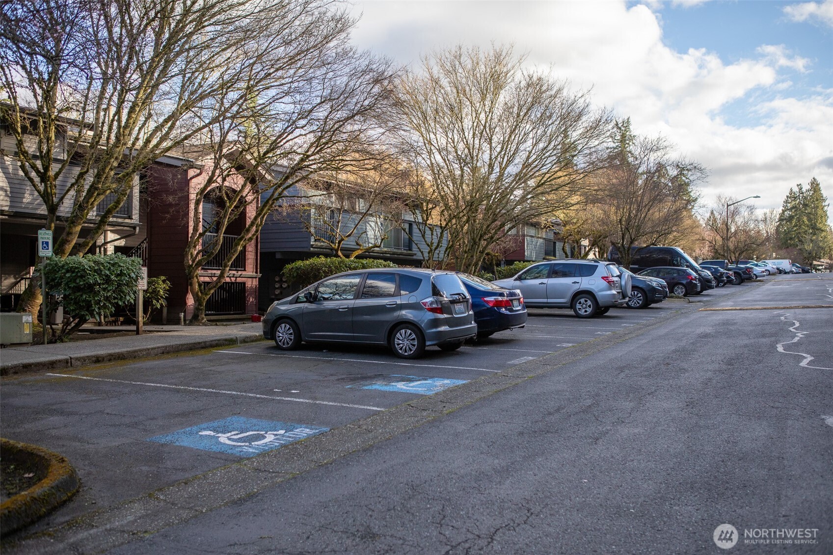 15917 Waynita Way Northeast, Unit E206 Bothell, WA 98011 - Photo 19 of 22 a view of cars parked on a city street