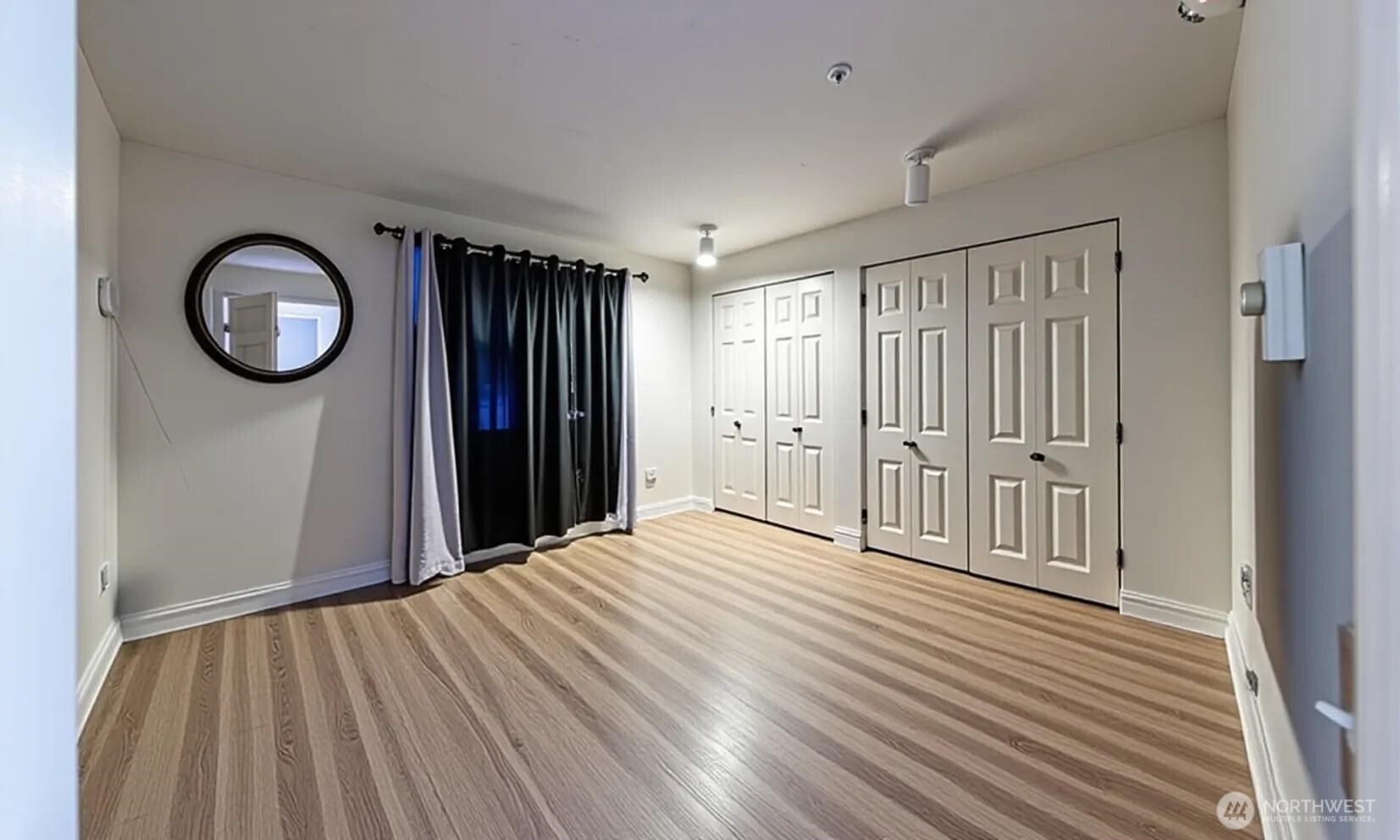15917 Waynita Way Northeast, Unit E206 Bothell, WA 98011 - Photo 8 of 22 a view of a livingroom with wooden floor